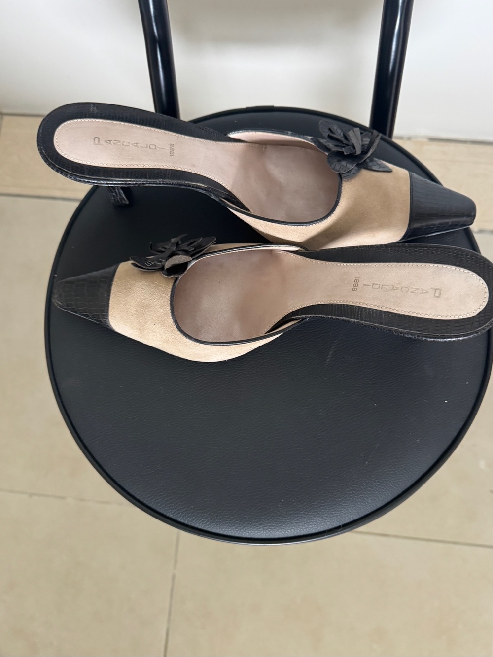 Beige and Black Pointed-Toe Slip-On Mules with Floral Accent